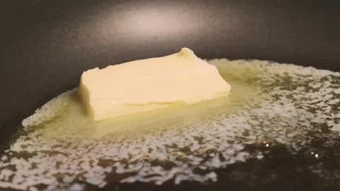 Chef Melts Down A Piace Of Diary Butter On A Frying Pan To Fry Food Stock Footage 157991477