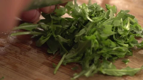 Chef mincing Arugula, Slow Motion Stock Footage 85784695