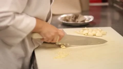 Chef mincing garlic Stock-Footage 10680293