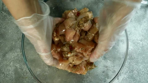 Chef mixed raw chicken breasts, cut into small pieces. Vídeo Stock 132172270