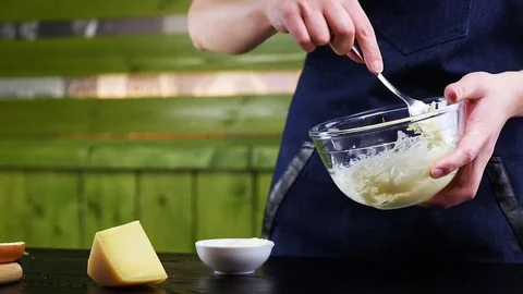 Chef mixes cheese with sauce, closeup Stock Footage 73765327