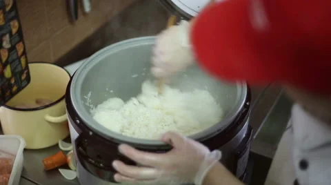The chef mixes the cooked rice Stock Footage 59699210