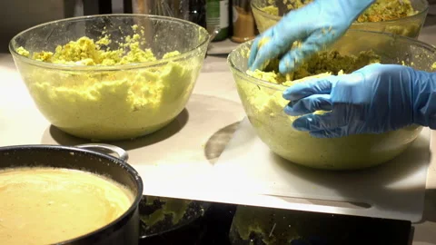 The chef mixes his hands a mixture of different ingredients Stock Footage 87276608