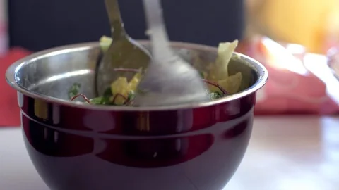 Chef mixes ingredients of vegetable salad in a bowl. Video stock 103308873