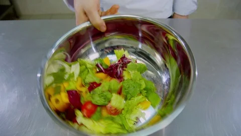 The chef mixes a salad 스톡 동영상 70986500