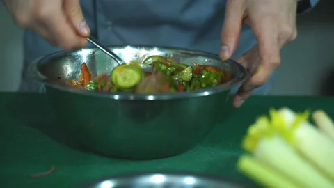 The chef mixes a salad Stock Footage 87426517