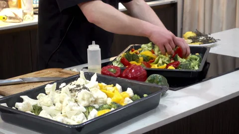 Chef mixes vegetables for cooking. Stock Footage 87277919