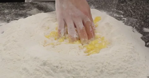 Chef mixes whipped eggs with flour. Dough preparation for bread, pasta or pizza Stock Footage 269787356
