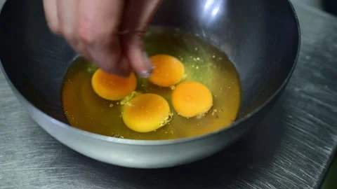 Chef mixing eggs and fried potatoes for spanish omelette Stock Footage 330428504