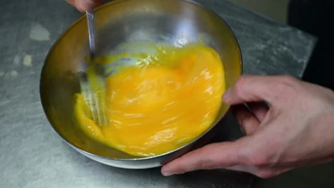 Chef mixing eggs and fried potatoes for spanish omelette 스톡 동영상 330428522