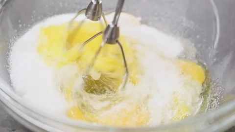 Chef is mixing eggs and sugar with electric mixer. Stock Footage 153459980