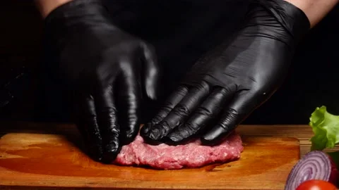 Chef mixing ground beef and shaping a burger patty Video stock 197438603