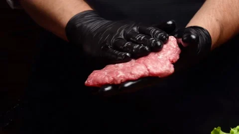 Chef mixing ground beef and shaping a burger patty Video stock 197438879