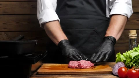 Chef mixing ground beef and shaping a burger patty Video stock 197524682