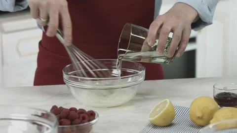 Chef Mixing Ingredients with Whisk for Bake Dish Stock Footage 160962824
