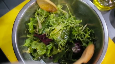 Chef mixing salad in the plate Stock Footage 67863433
