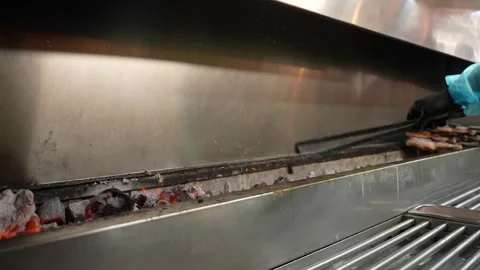 Chef moves embers of coal Stock Footage 272449314