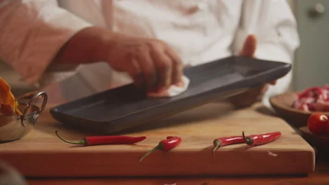 Chef oiling a tray with oil Stock Footage 274669952
