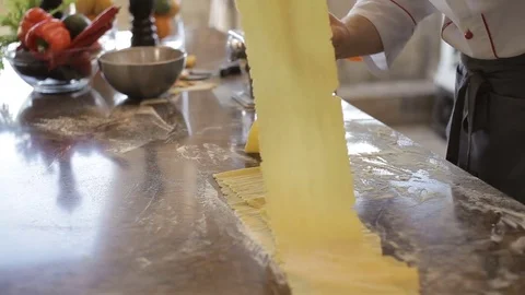 The chef in the open kitchen preparing a paste Stock Footage 77158777