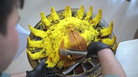 Chef Opening Crispy Lotus-Shaped Shell with Pilaf and Dried Fruits Stock Footage 321704783