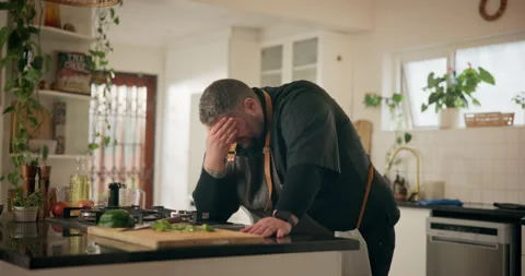 Chef, pain and man in kitchen, headache and thinking with burnout in restaurant Stock Footage 283444292