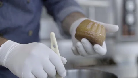 Chef paints a rum baba with sugar syrup, Lebanese dessert Stock Footage 158064399