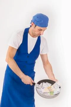 Chef with a pan full of banknotes Stock Photos