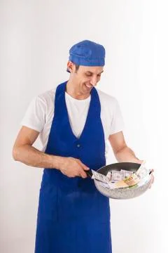 Chef with a pan full of banknotes Stock Photos