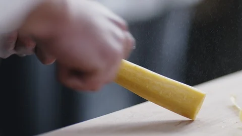 Chef is peeling a carrot Stock Footage 121666259