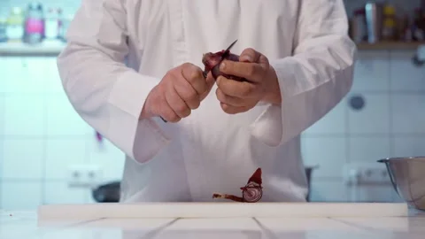The chef peeling onion. Stock Footage 154795090