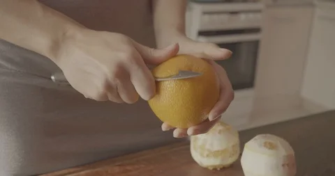 Chef Peeling Orange Stock Footage 97822423