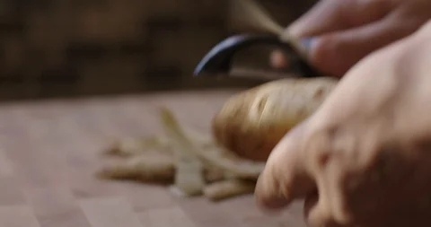 Chef Peeling Potatoes 스톡 동영상 105370656