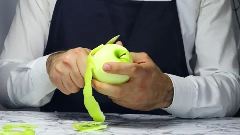 Chef peels the apple with a knife 스톡 동영상 182563003