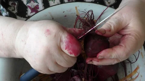 The chef peels a beet with a knife Stock Footage 163051087