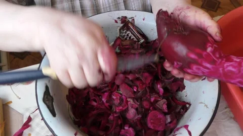 The chef peels the beets with a knife Stock Footage 160947696