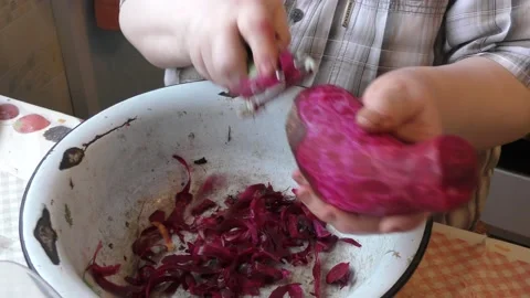 The chef peels the beets with a knife Stock Footage 167105415