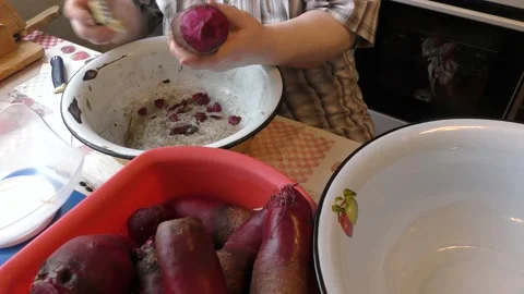 The chef peels the beets with a knife Stock Footage 167105624