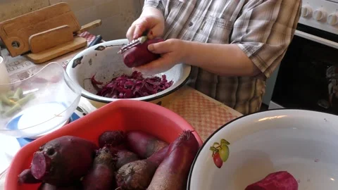 The chef peels the beets with a knife Stock Footage 167105686