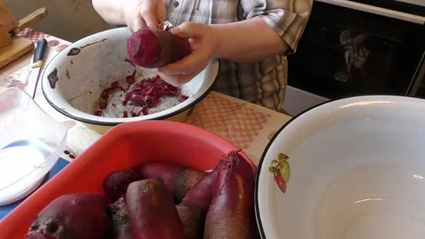The chef peels the beets with a knife Stock Footage 167105810