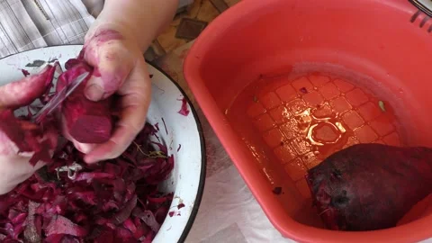 The chef peels the beets with a knife Stock Footage 167105883