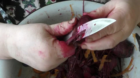 The chef peels boiled beets with a knife Stock Footage 164187115