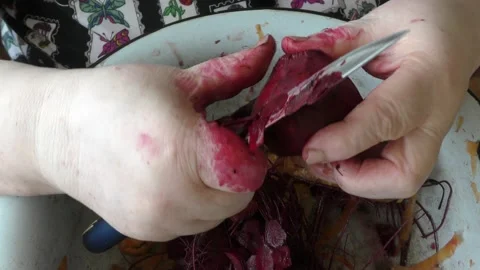 The chef peels boiled beets with a knife Stock Footage 164187314