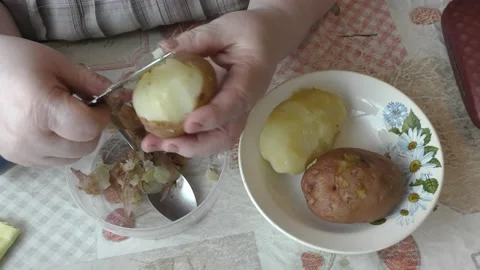 The chef peels the boiled potatoes Stock Footage 165151644
