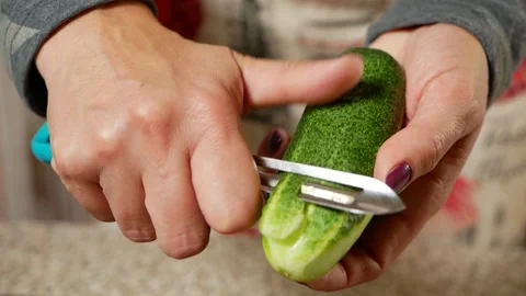 The chef peels the cucumber Stock Footage 161224256