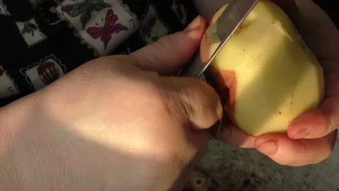 The chef peels a potato with a knife Stock Footage 166707929