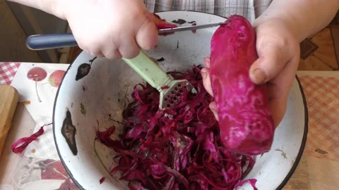 The chef peels raw beets with a knife Stock Footage 162723945