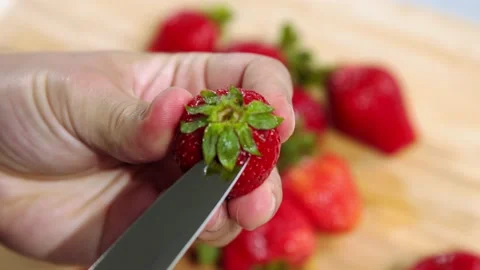Chef peels the Strawberry Stock Footage 221567711