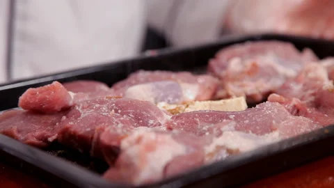 Chef peppers chopped meat on a baking sheet 스톡 동영상 87049612