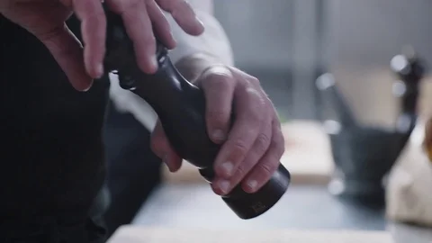 Chef peppers a dish Stock Footage 78031441