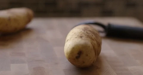 Chef Picking Up And Peeling Potato 스톡 동영상 105370674